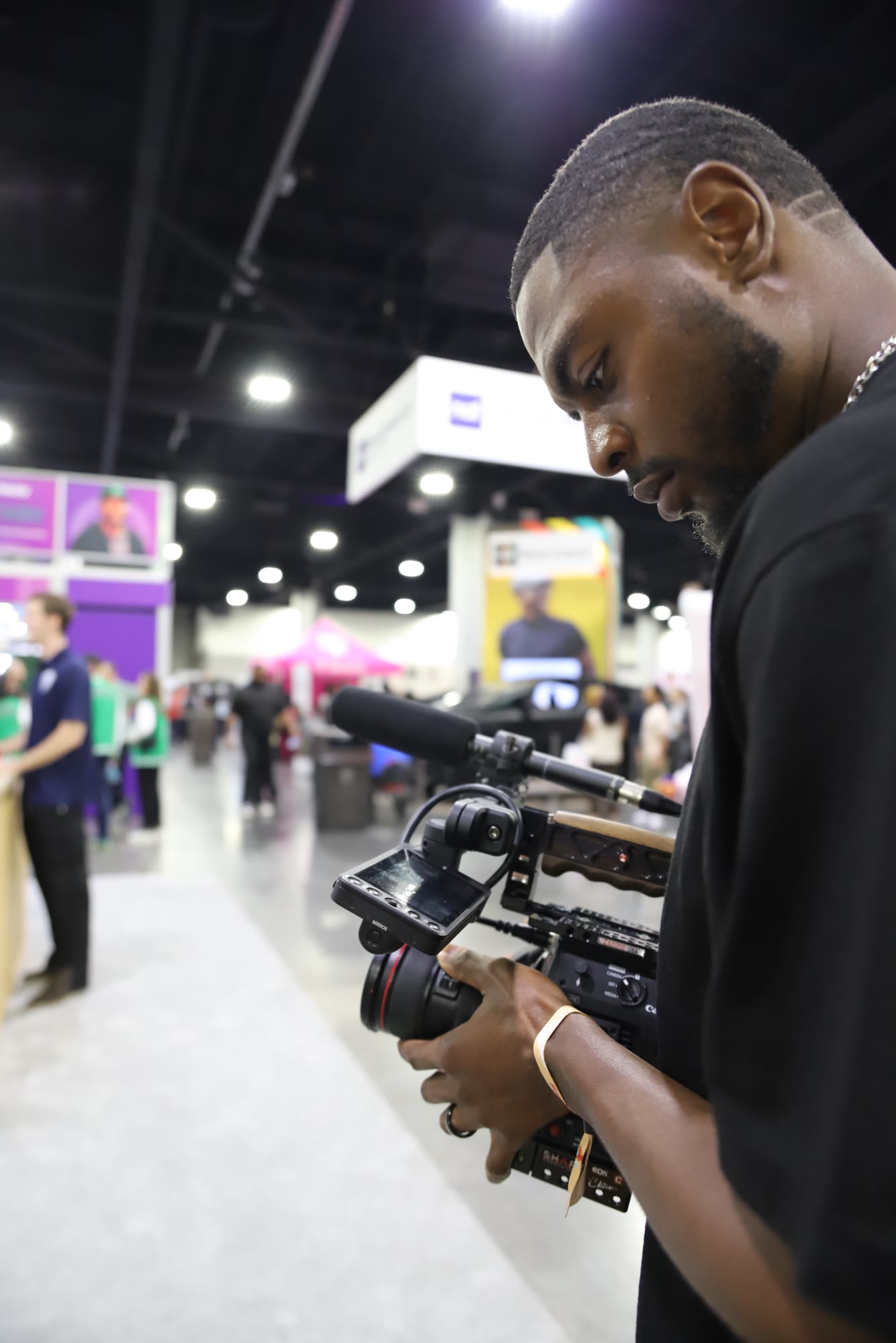 Checking a shot on a cinema camera at an expo