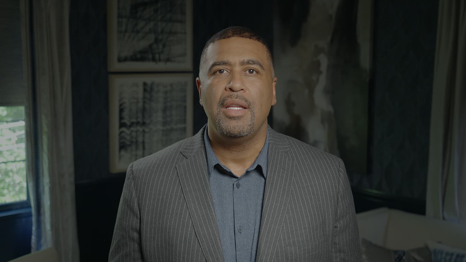 John Bey speaking to camera in a corporate interview